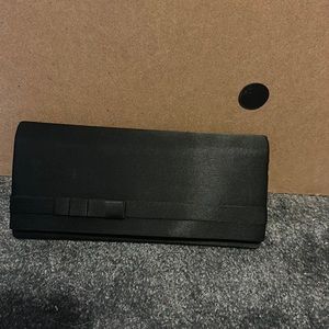 Gently used, good condition black clutch